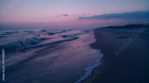 Quiet beach at dawn. Serene morning by the ocean. Beautiful sunrise over water. Tranquil seaside escape. photo