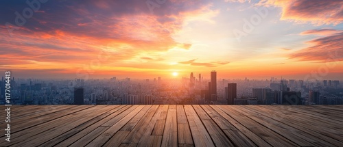 A view of a city skyline with skyscrapers during sunset, seen from a rooftop deck with wood planks