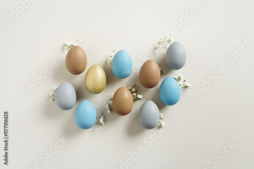 Wallpaper Mural Easter Aesthetic with Matte Eggs and Delicate Florals, painted chicken egg decorated white flowers, top view on beige background, spring holiday concept. Minimal style pattern in pastel tones Torontodigital.ca