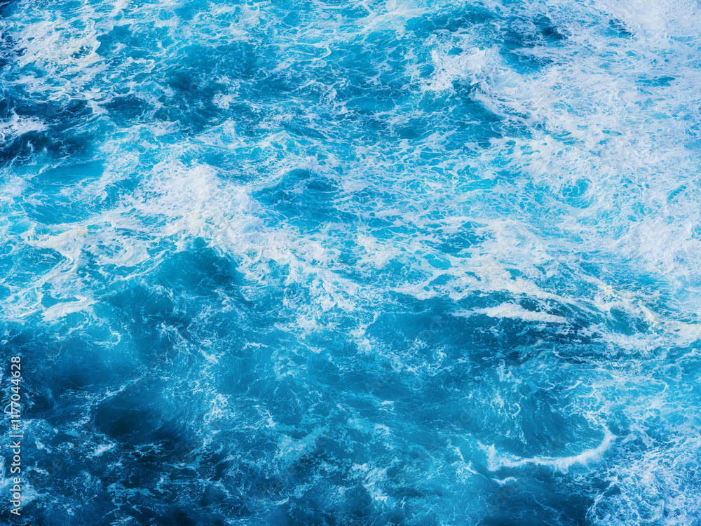 Waves as background. Huge ocean waves near the coast. Nature. Background and wallpaper in nature. Water surface as texture. Blue water and sea foam. Waves as background. Huge ocean waves near the coast. Nature. Background and wallpaper in nature. Water surface as texture. Blue water and sea foam.