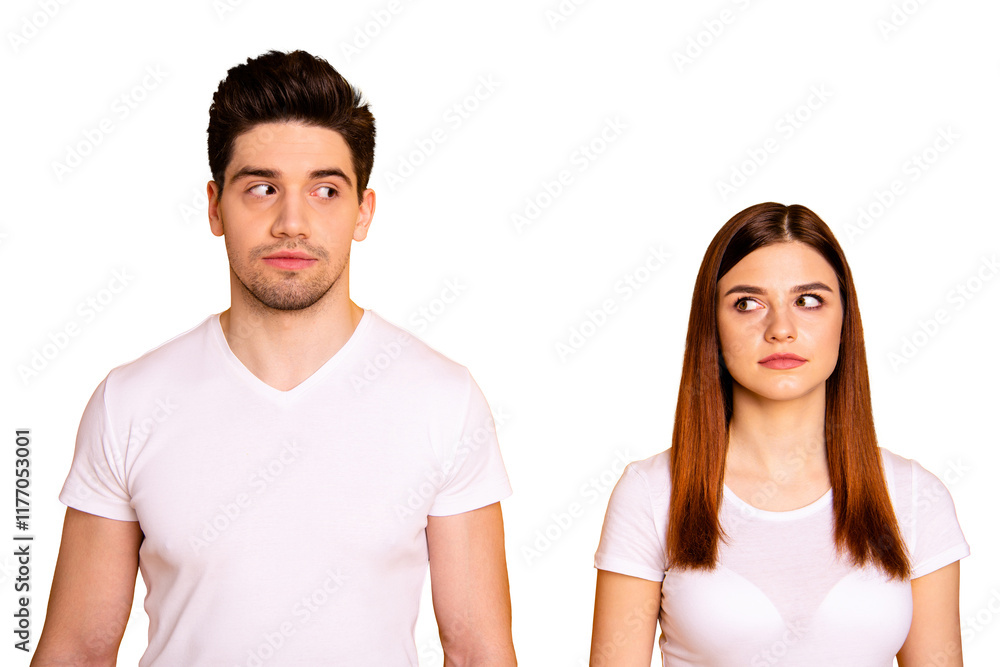 Close up photo two amazing beautiful she her he him his couple standing side by side look each other not smile tell talk speak say wear casual white t-shirts outfit clothes isolated yellow background Close up photo two amazing beautiful she her he him his couple standing side by side look each other not smile tell talk speak say wear casual white t-shirts outfit clothes isolated yellow background