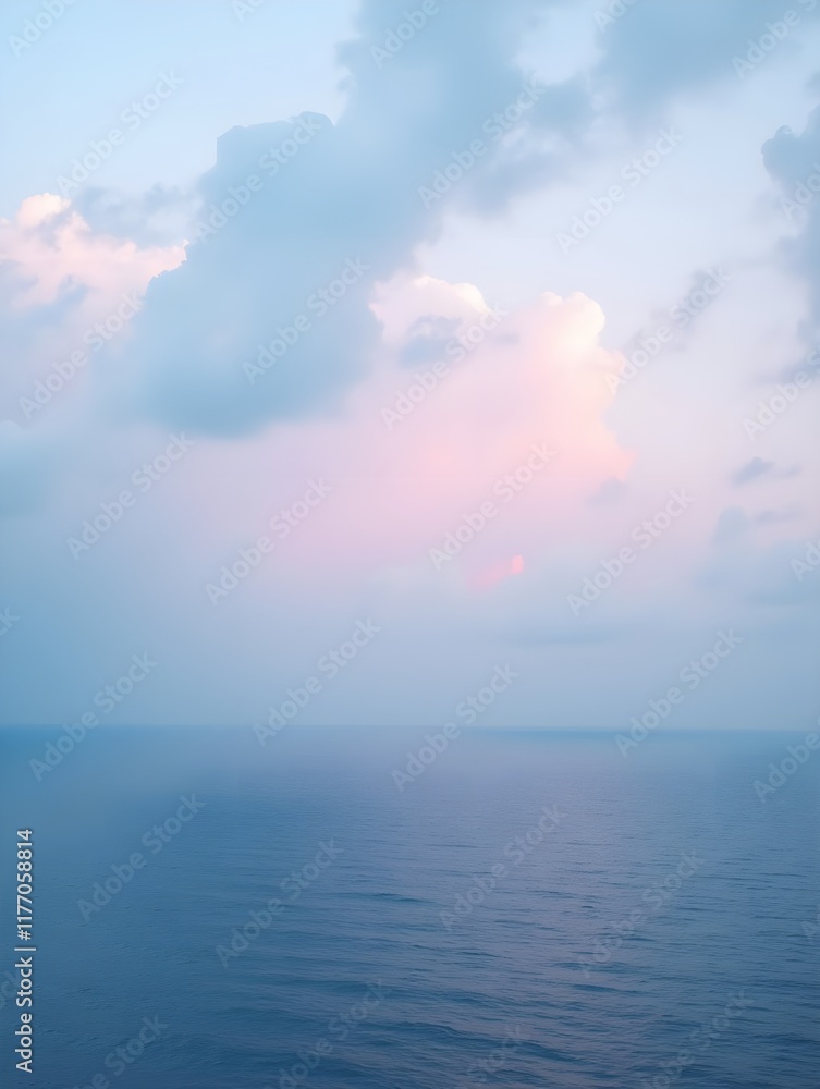 Beautiful view of the ocean with a cloudy sky. The sky is a mix of pink and blue colors Beautiful view of the ocean with a cloudy sky. The sky is a mix of pink and blue colors