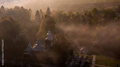 Fototapeta Naklejka Na Ścianę i Meble -  Scenic Drone Shot of Traditional Orthodox Church in Poland's Carpathian Range