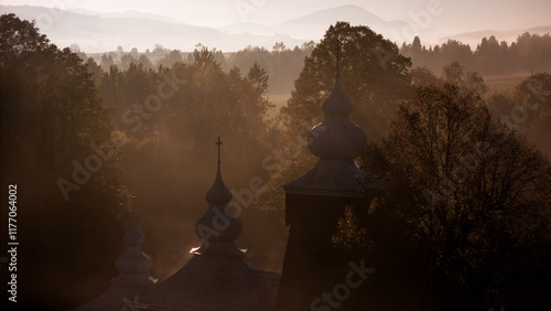 Fototapeta Naklejka Na Ścianę i Meble -  Scenic Drone Shot of Traditional Orthodox Church in Poland's Carpathian Range