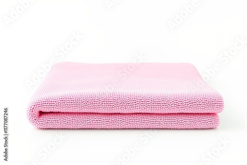 A neatly folded pink microfiber cloth displayed on a plain white background. The soft texture and color emphasize cleanliness and hygiene. Ai generative