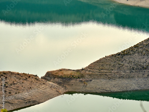 Iznájar Reservoir. The largest reservoir in Andalusia. Green water. Effects of drought.