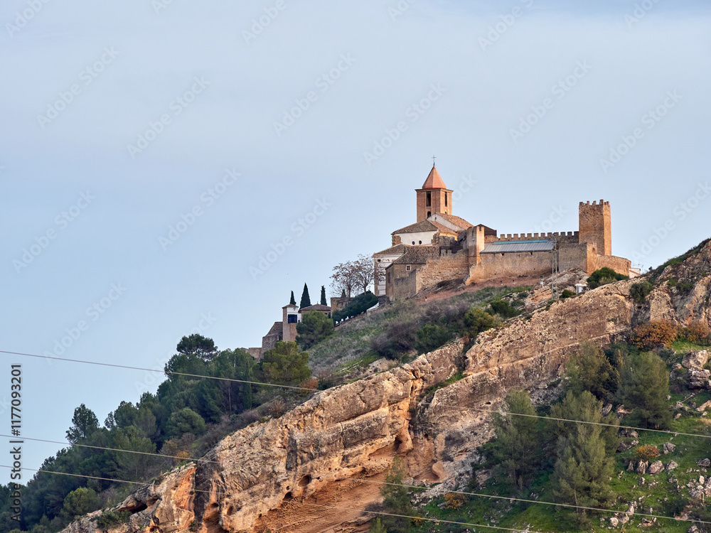 Iznajar village. Mountain village surrounded by the Iznajar Reservoir. Parish of Santiago Apostol. Iznajar Castle Iznajar village. Mountain village surrounded by the Iznajar Reservoir. Parish of Santiago Apostol. Iznajar Castle