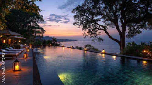 Relaxing evening at a stunning poolside with lanterns and ocean view during s...