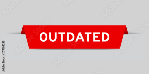 Red color inserted label with word outdated on gray background