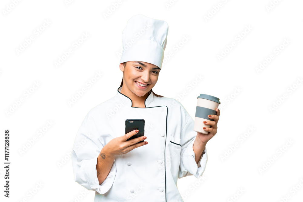 Young woman Chef over isolated chroma key background holding coffee to take away and a mobile Young woman Chef over isolated chroma key background holding coffee to take away and a mobile
