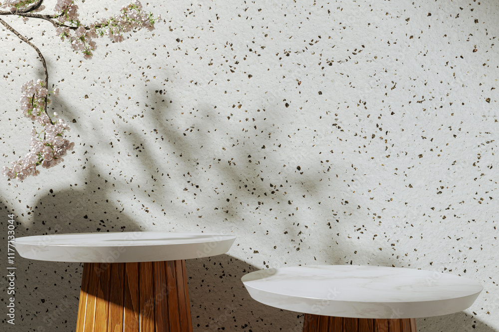 A marble round table for presenting products against the background of a concrete wall surrounded by greenery. Shadows of sunlight on the wall. Background for the presentation of cosmetic products