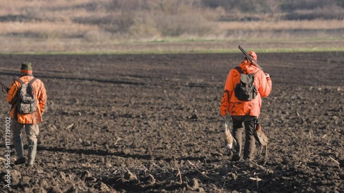 During small game hunting, the hunter carries the game he has killed: rabbits and pheasants.