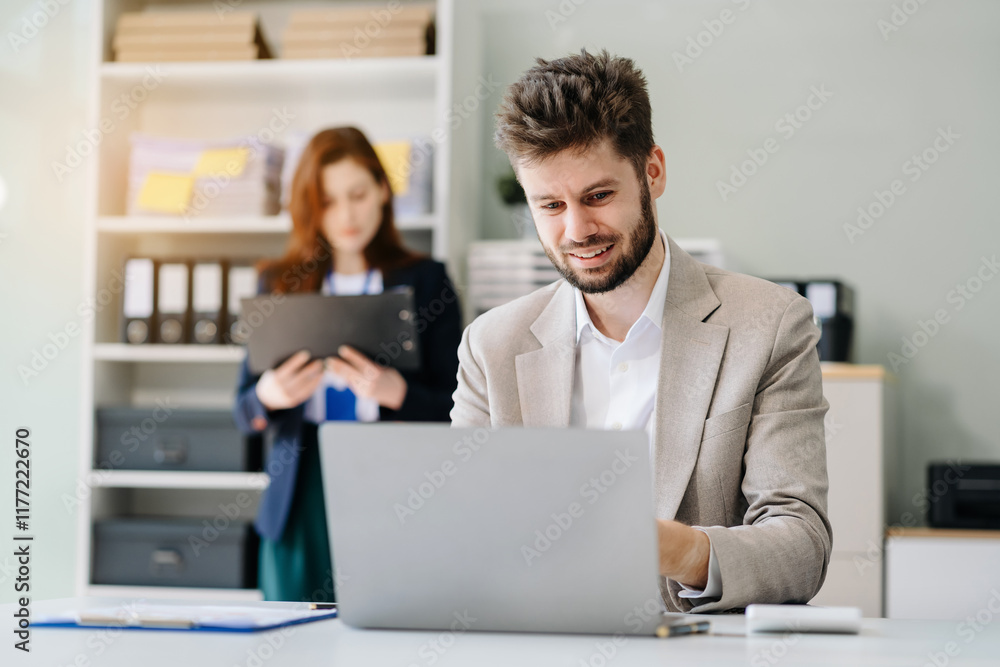 Businessman using laptop computer in office. Happy man, entrepreneur, small business owner working online. Businessman using laptop computer in office. Happy man, entrepreneur, small business owner working online.