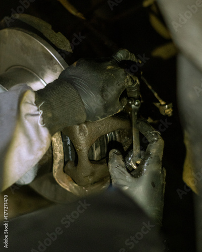 auto mechanic works with the auto brake photo