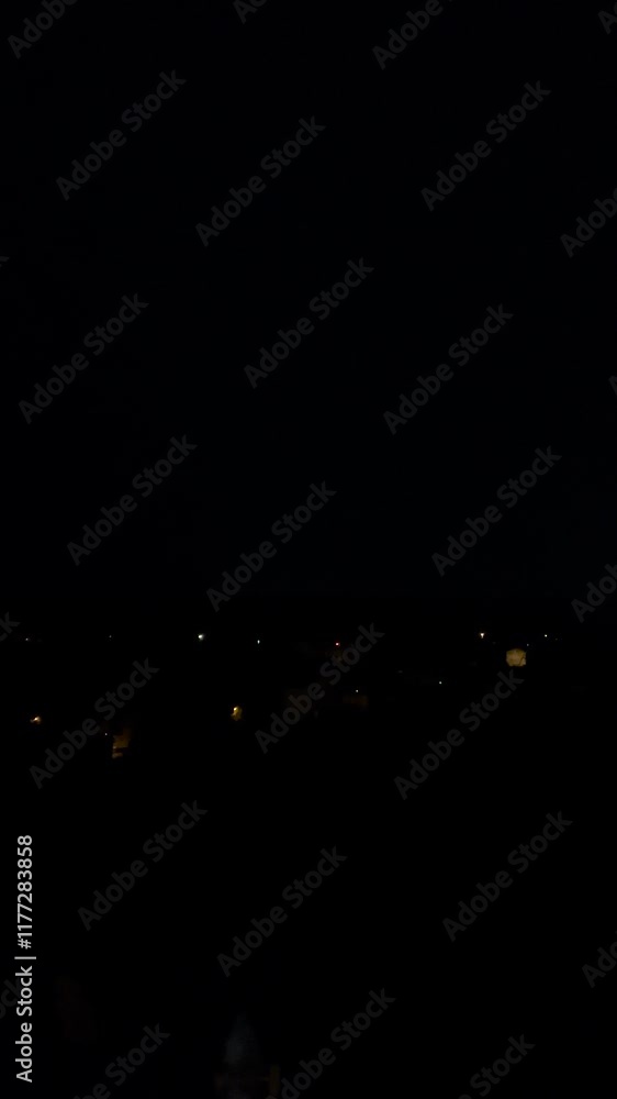 Storm clouds and lightning in the night sky. Vertical video. Storm clouds and lightning in the night sky. Vertical video.