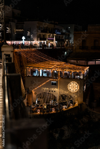 Streetphotography in Polignano a Mare at Christmas Time. Puglia. Italy.
