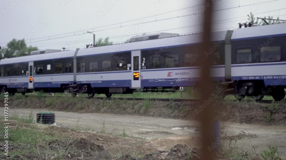 Slow Motion 4K: Train Passing Through the City in Daylight Slow Motion 4K: Train Passing Through the City in Daylight