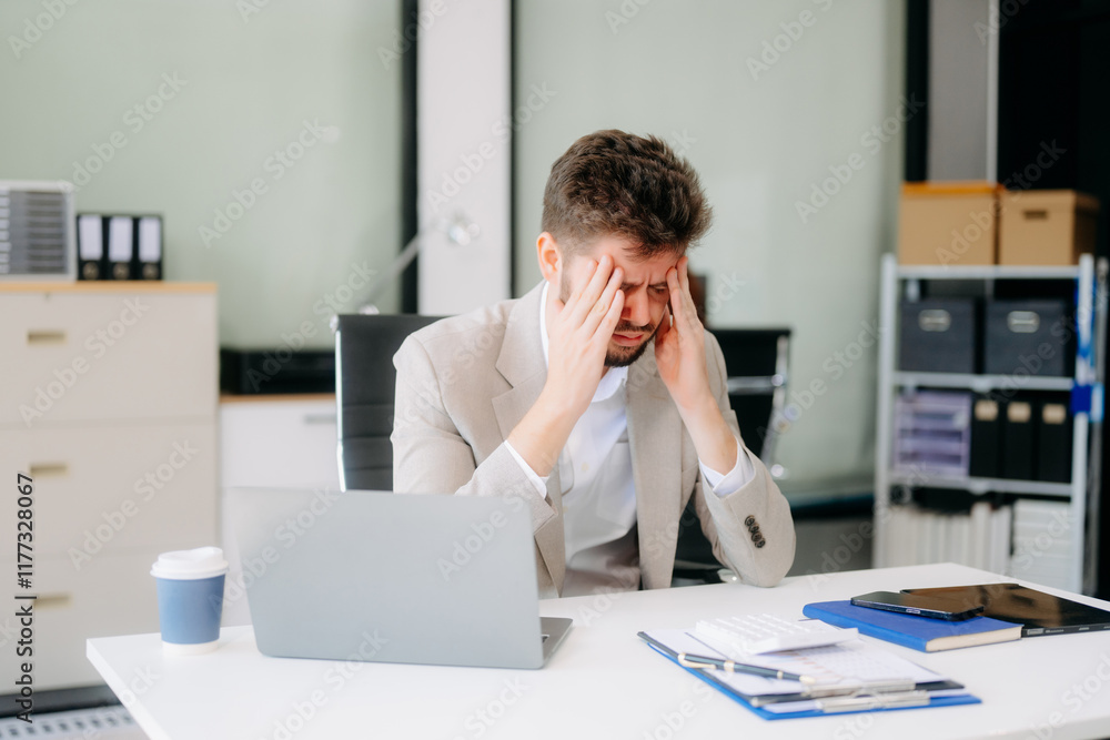 Businessman is stressed, bored, and overthinking from working on a tablet Businessman is stressed, bored, and overthinking from working on a tablet