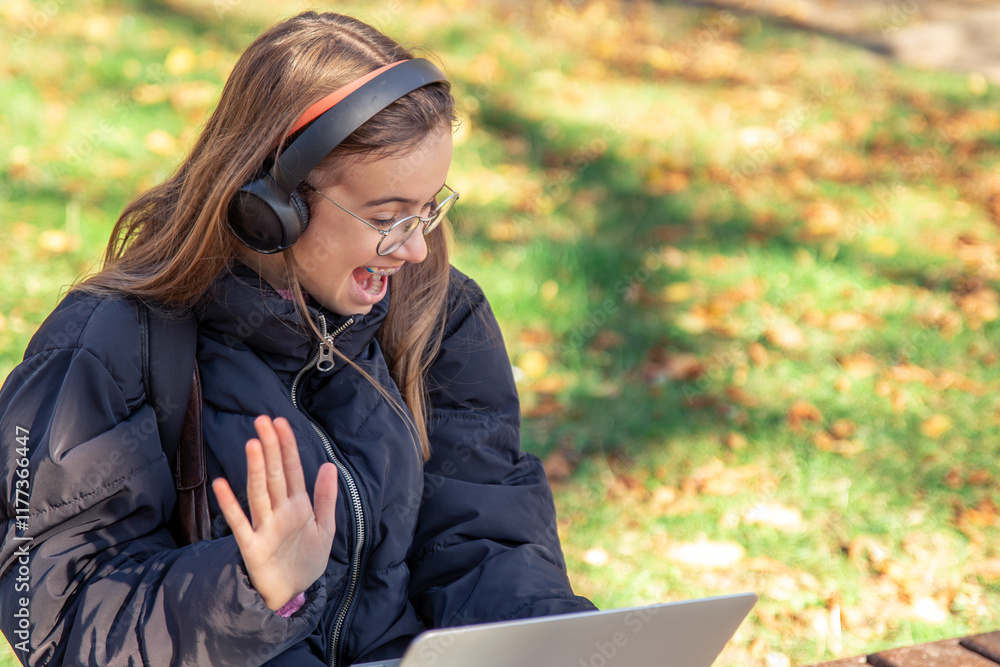 Happy teenage girl talking on video call. A girl with a laptop. Happy teenage girl talking on video call. A girl with a laptop.
