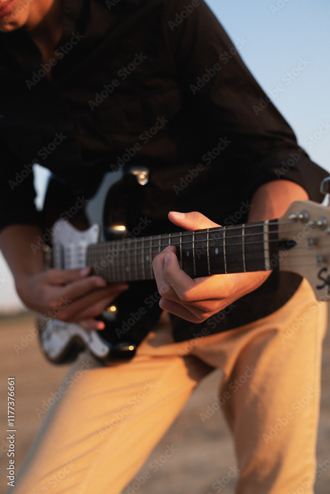 Obraz premium man playing guitar