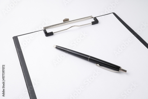 Wallpaper Mural A close-up photo of a black clipboard and a classic pen to writing something on a blank white sheet of paper. Isolated on white background. Torontodigital.ca