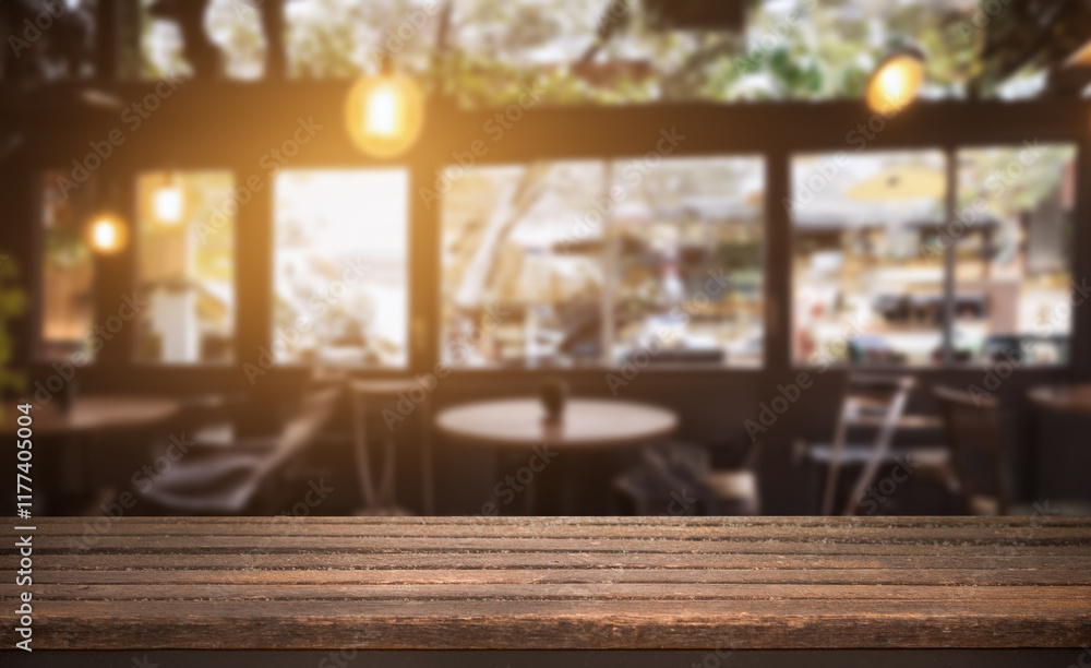 Empty wooden table in a sunlit cafe with blurred background of chairs and windows. Empty wooden table in a sunlit cafe with blurred background of chairs and windows.