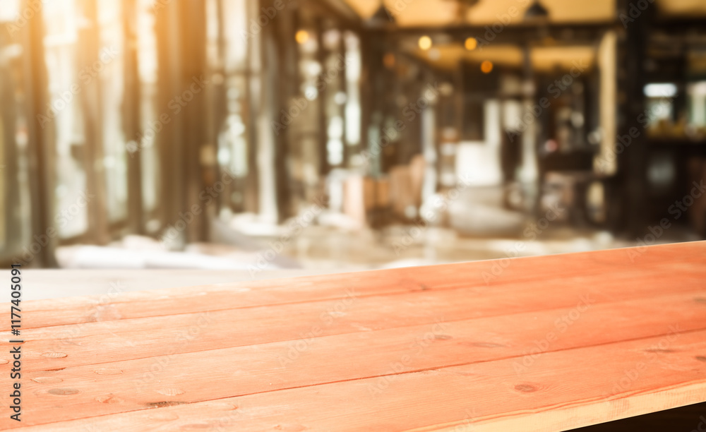 Empty wooden table against a blurred background of a modern cafe interior. Perfect for product placement or montage. Empty wooden table against a blurred background of a modern cafe interior. Perfect for product placement or montage.