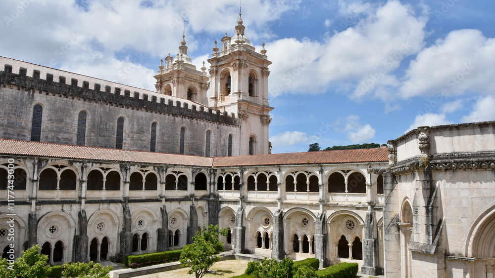 Monastery Courtyard with Landscaped Garden, Elevated Arcade, and Dual Towers Monastery Courtyard with Landscaped Garden, Elevated Arcade, and Dual Towers