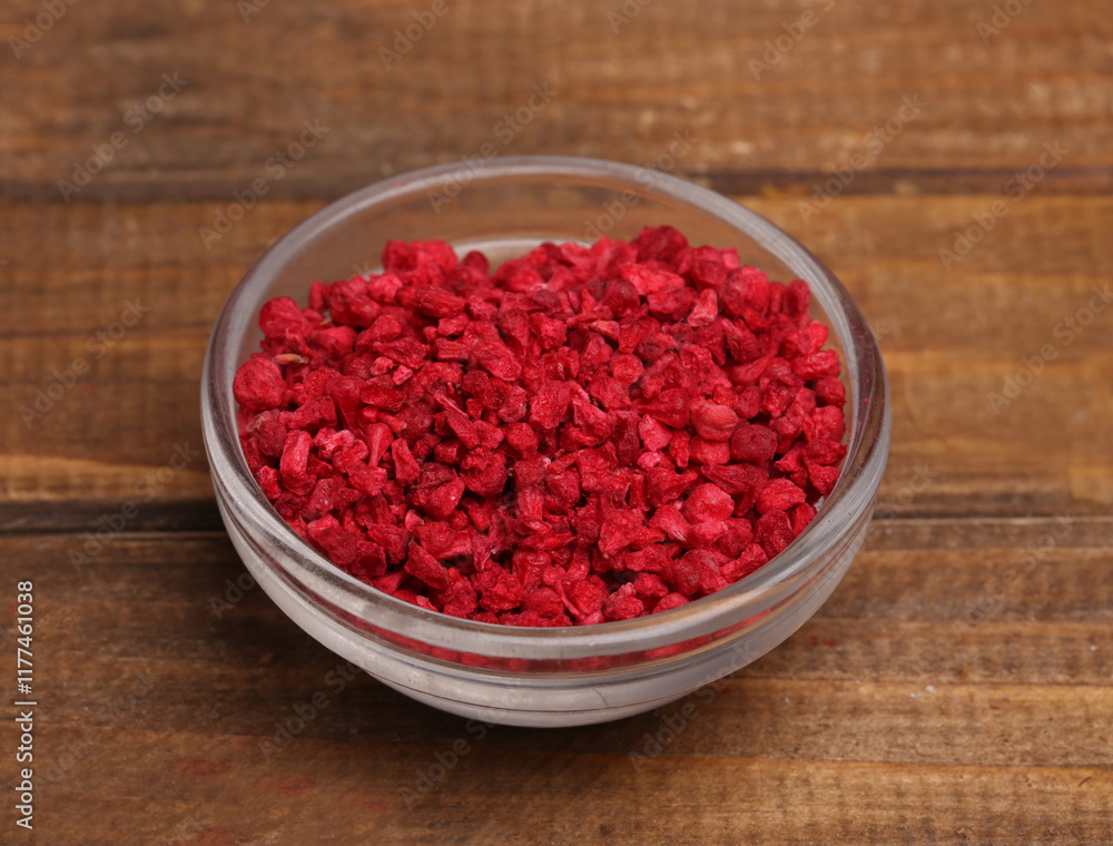 bowl with dry raspberries on a rustic background bowl with dry raspberries on a rustic background