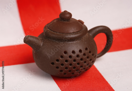 teapot on the background of the flag of England. The concept of traditional symbols of Great Britain photo