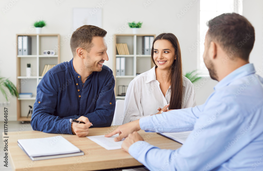 Male solicitor pointing at insurance document, contract showing to write signature sign, sale, purchase, rent or employment agreement at meeting to make financial business deal, bank loan service Male solicitor pointing at insurance document, contract showing to write signature sign, sale, purchase, rent or employment agreement at meeting to make financial business deal, bank loan service