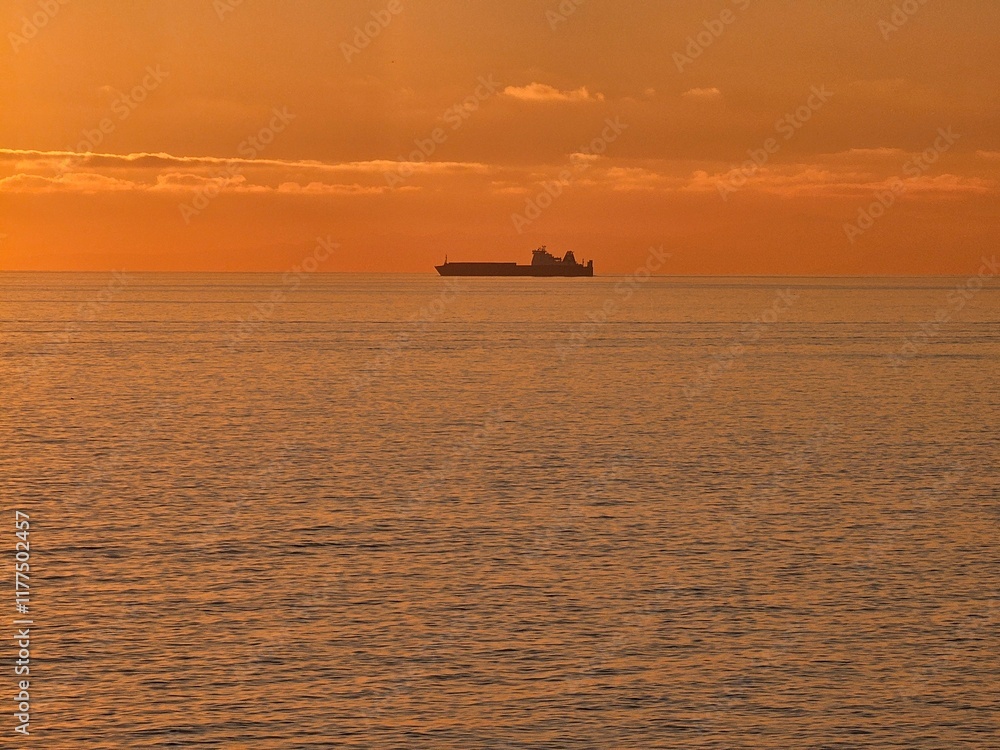 Genova, Italy - December 29, 2024: Background of beautiful sunset over Mediterranean sea waves. Selective focus. Beautiful red and orange sunrise over the sea. Beautiful seascape scenery, Amazing ligh Genova, Italy - December 29, 2024: Background of beautiful sunset over Mediterranean sea waves. Selective focus. Beautiful red and orange sunrise over the sea. Beautiful seascape scenery, Amazing ligh