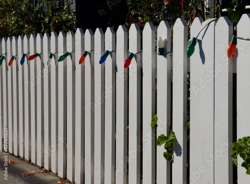 white picket fence with Christmas lights photo