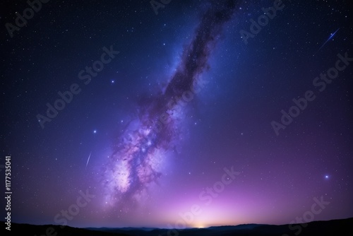 purple and blue galaxy with a star filled sky and a bright star photo