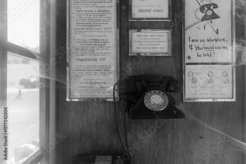 Old analogue telephone in an obsolete landline network with cobwebs. Digital upgrade. photo