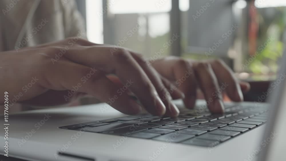 A person is typing on a laptop computer. Concept of productivity and focus, as the person is engaged in a task that requires concentration. The laptop itself is a modern and sleek device A person is typing on a laptop computer. Concept of productivity and focus, as the person is engaged in a task that requires concentration. The laptop itself is a modern and sleek device