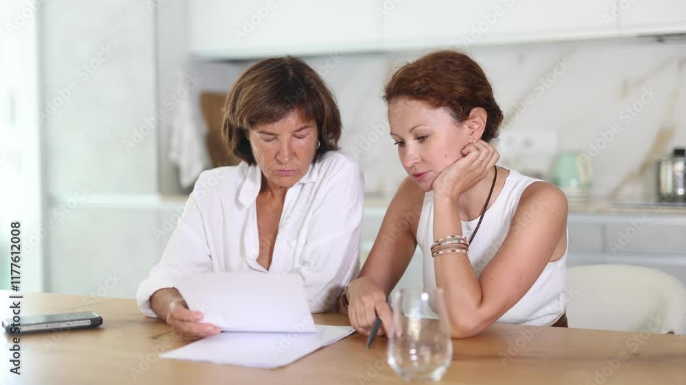 Two women have unpleasant conversation in dining room. High quality 4k footage Two women have unpleasant conversation in dining room. High quality 4k footage
