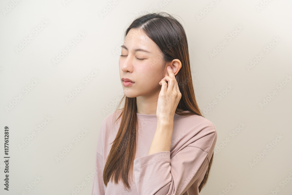 Tinnitus concept, sick asian young woman, girl have ear pain or earache, hand touch plug ear, suffering painful otitis from loud of noisy sound, inflammation. Health care nerve deaf eardrum disease. Tinnitus concept, sick asian young woman, girl have ear pain or earache, hand touch plug ear, suffering painful otitis from loud of noisy sound, inflammation. Health care nerve deaf eardrum disease.