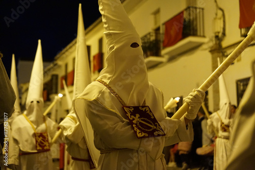 Hooded penitents in a procession during Semana Santa (Holy Week) in Andalusia, Spain photo