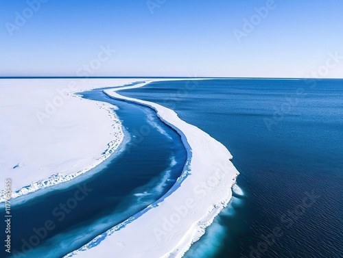 Wind farms along a frostcovered coastline, symbolizing renewable energys resilience to extreme cold photo