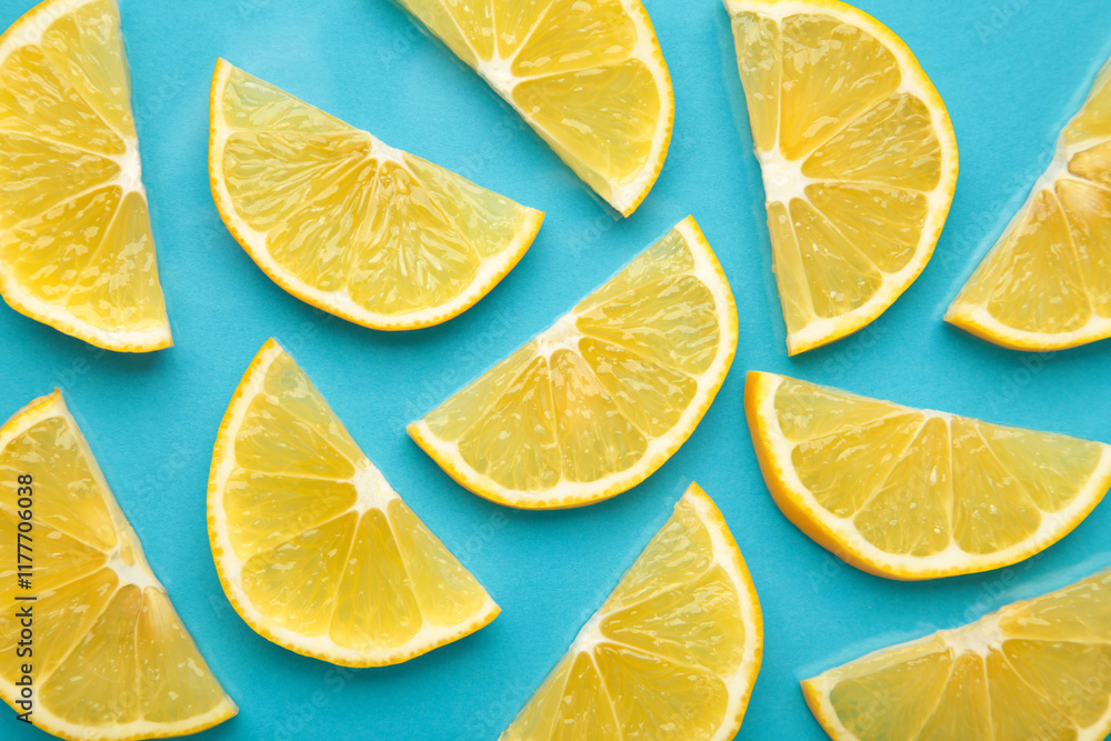 Fototapeta premium Lemon slices texture on blue background