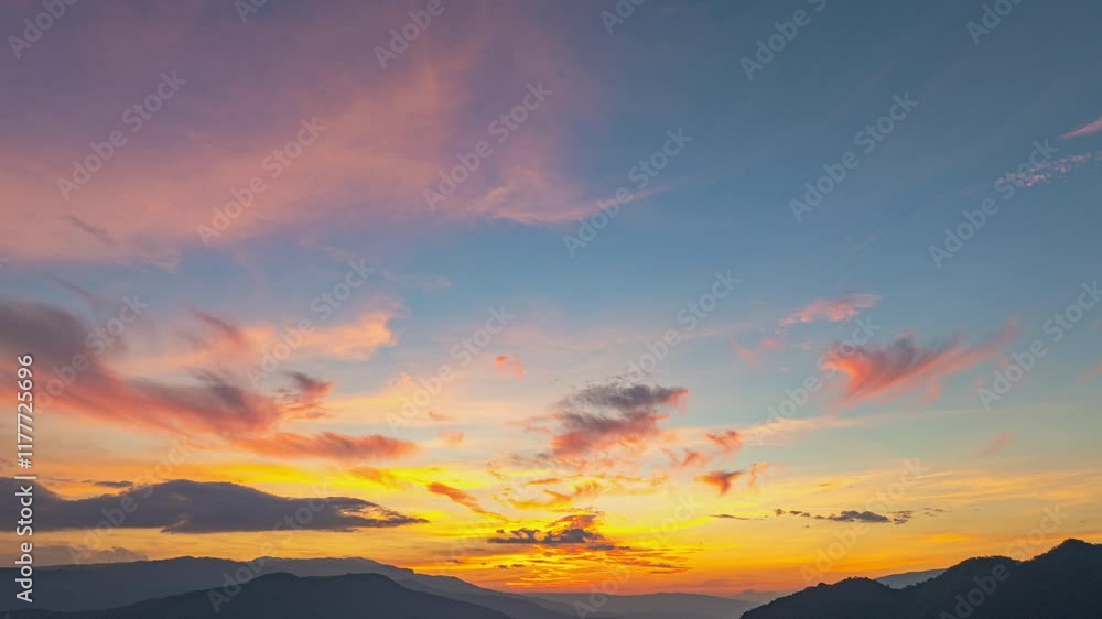 Time lapse A breathtaking view of a colorful sunset over layered mountain silhouettes, with warm hues of orange, pink, and blue blending seamlessly across the sky. Time lapse A breathtaking view of a colorful sunset over layered mountain silhouettes, with warm hues of orange, pink, and blue blending seamlessly across the sky.