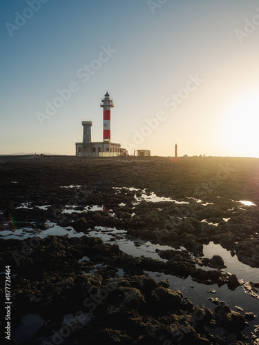 Portrait photograph of a lighthouse at sunset