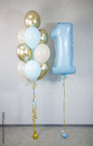blue foil number 1 balloon and bunch of latex helium balloons for birthday