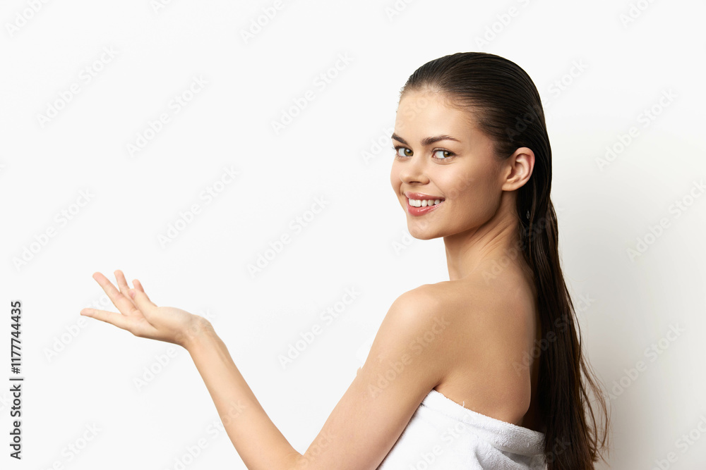 Young woman smiling with wet hair presenting on white background, showcasing beauty and confidence Natural pose exudes positivity and freshness, ideal for wellness or skincare themes Young woman smiling with wet hair presenting on white background, showcasing beauty and confidence Natural pose exudes positivity and freshness, ideal for wellness or skincare themes