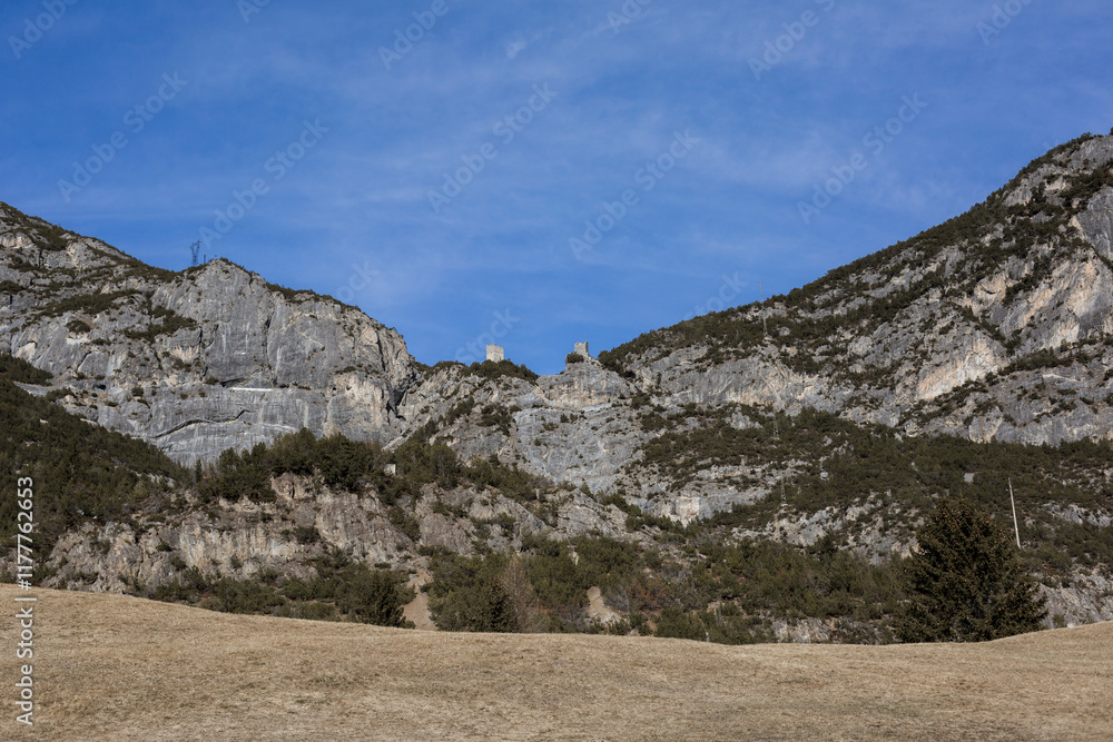Rocky cliffs with ancient ruins under blue sky Rocky cliffs with ancient ruins under blue sky