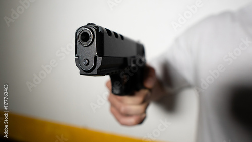 man aiming his gun