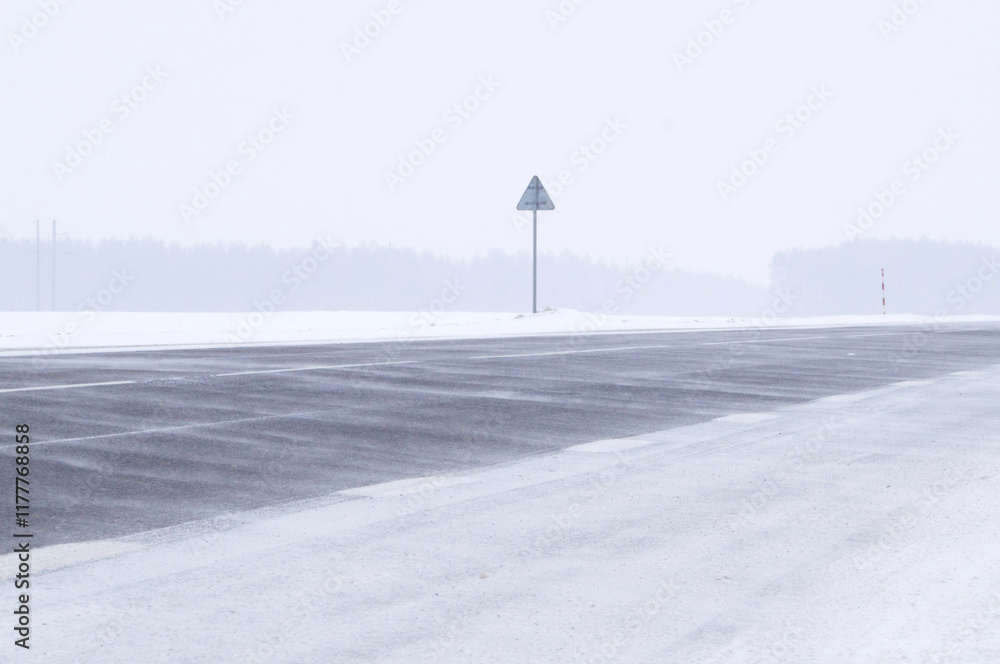 Unfavorable weather conditions. Winter road car into a strong storm Unfavorable weather conditions. Winter road car into a strong storm