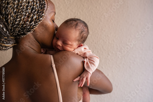 Mom showing love to newborn photo