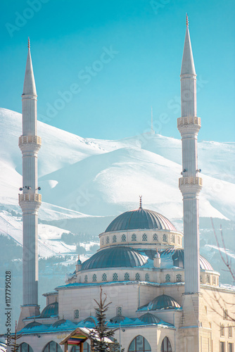 Ramadan or Islamic background: Alkazan Mosque and Palandoken Mountain, Turkey photo